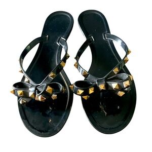 Studded gold & black jelly flip flops